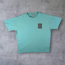 Load image into Gallery viewer, Weird Fish "Not Weird Just Different" Cartoon Spellout Graphic Turquoise T-Shirt
