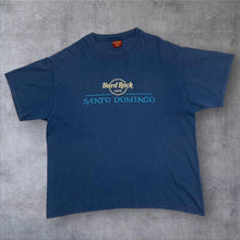 Load image into Gallery viewer, Early 00’s Hard Rock Cafe “Santo Domingo” Souvenir Spellout Graphic T-Shirt
